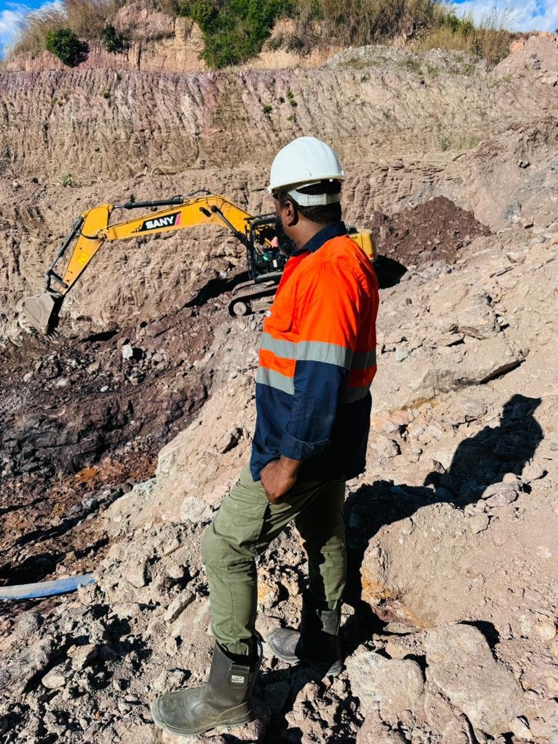 Humtal field personnel overlooking mining operations in the DRC